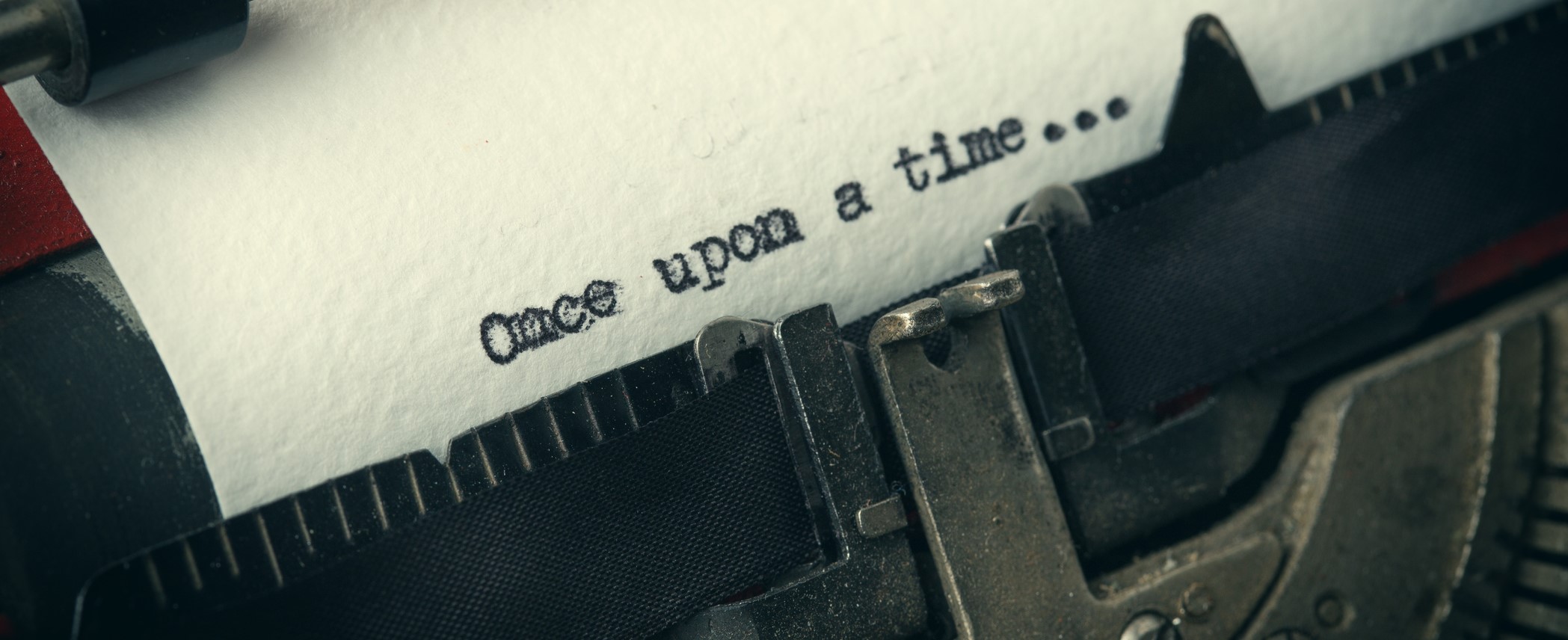 Close up of old typewriter covered with dust with Once upon a time text